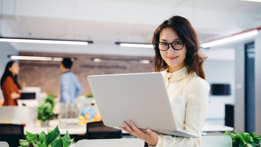Corporate girl handling her laptop